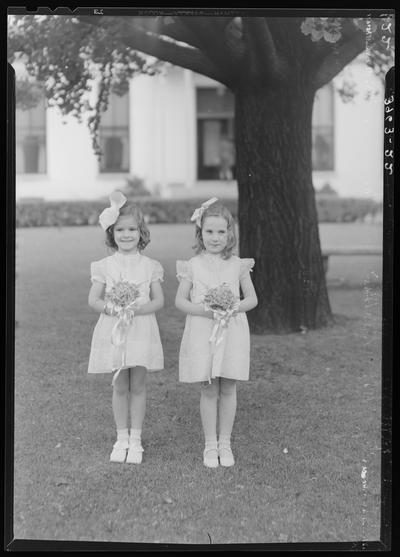 St. Joseph's Hospital, 544 West Second (2nd) Street; graduation exercises (nurses), two (2) young girls posing in front of a tree