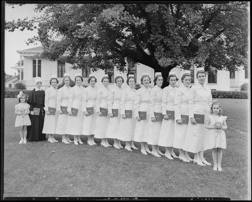 St. Joseph's Hospital, 544 West Second (2nd) Street; graduation exercises (nurses), nurses holding diplomas while posing outside