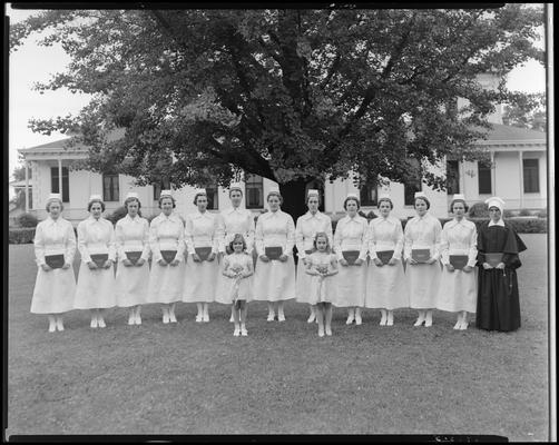 St. Joseph's Hospital, 544 West Second (2nd) Street; graduation exercises (nurses), nurses holding diplomas while posing outside