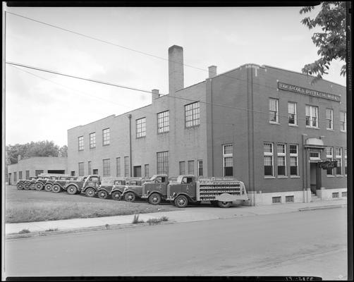 Coca-Cola Bottling Works, 541 West Short; exterior, delivery trucks parked along side of building