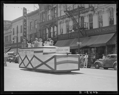 Labor Day Parade, Bluegrass Typographical Union float, Dan Cohen Shoes and F.W. Woolworth (268-274 West Main) buildings behind float