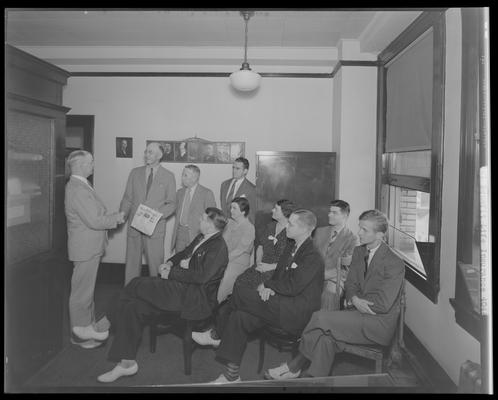Mutual Benefit Life Insurance Company (167 West Main); salesmen group; two men shaking hands and one receiving award