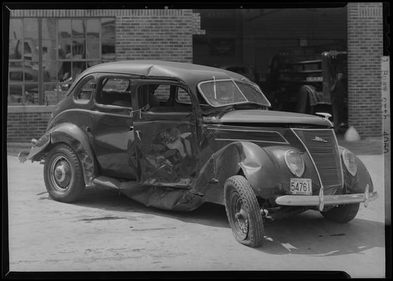 Powell Bosworth's wrecked car; passenger side damage, ordered by Frank McCarthy