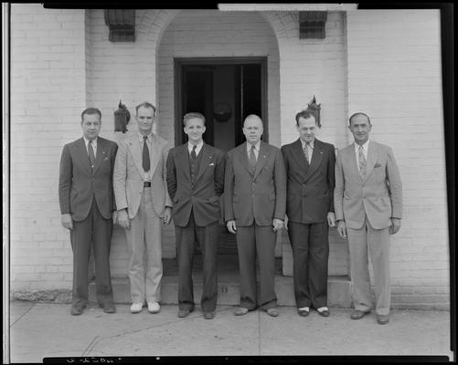 Bluegrass Automobile Club; group of men standing outside exterior of building