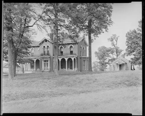 Alf Ruh Estate; exterior front of house with tall trees in the front lawn (128 Fairlawn Avenue)