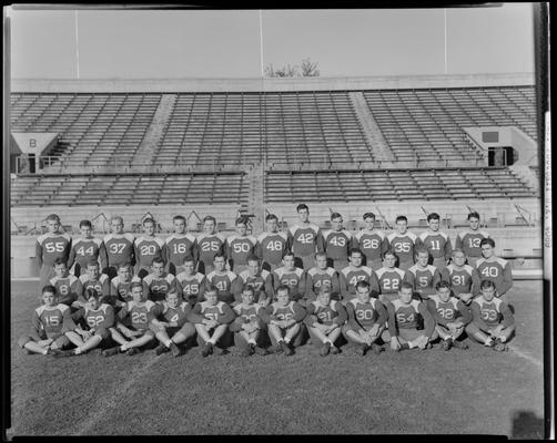 1939 University of Kentucky Football Team; varsity, team members posing for group photo on field