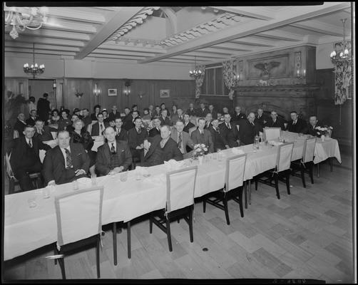 W. T. Sistrunk & Company banquet; people sitting at table in dinning room