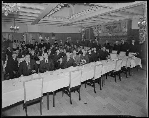 W. T. Sistrunk & Company banquet; people sitting at table in dinning room