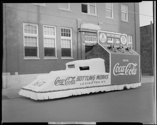 Coca-Cola Bottling Works, 541 West Short; float in the shape of a six (6) pack of bottles, three (3) women riding on the float
