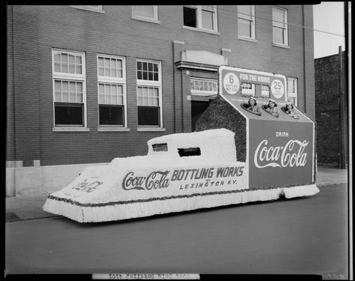 Coca-Cola Bottling Works, 541 West Short; float in the shape of a six (6) pack of bottles, three (3) women riding on the float