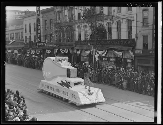 Tobacco Carnival; parade scene, float, Lexington Utilities Company; Dan Cohen Shoes (258 West Main) and Woolworth (268-274 West Main) in the background