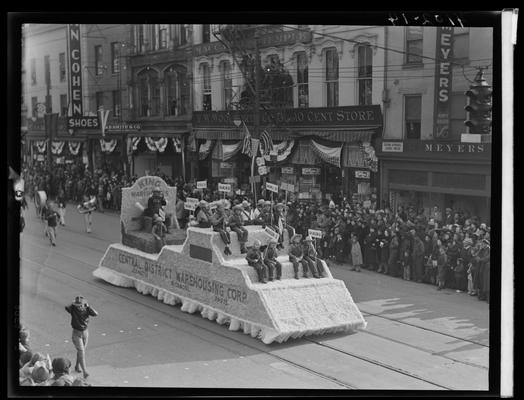 Tobacco Carnival; parade scene, float, Central District Warehousing Corporation; Dan Cohen Shoes (258 West Main) and Woolworth (268-274 West Main) in the background