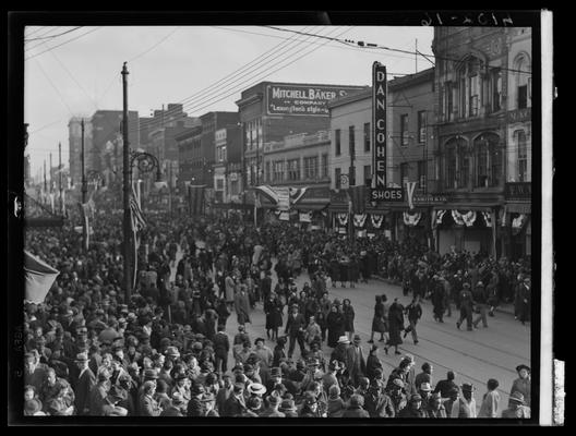 Tobacco Carnival; parade scene, large crowd gathered in the street; Dan Cohen Shoes (258 West Main) in the background