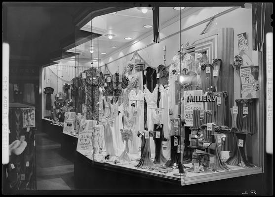 Miller's Store (216 West Main), exterior, window display (women's clothing); photographed at night