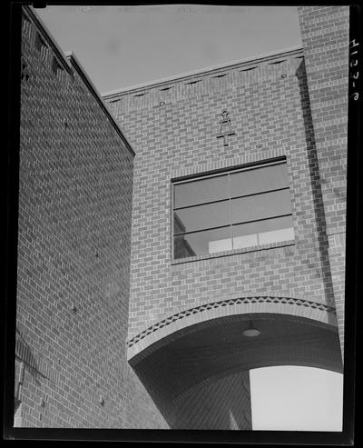 Campus Scenes; (1939 Kentuckian) (University of Kentucky), exterior, brick wall and archway with Tau Beta Pi engineering society ornamentation
