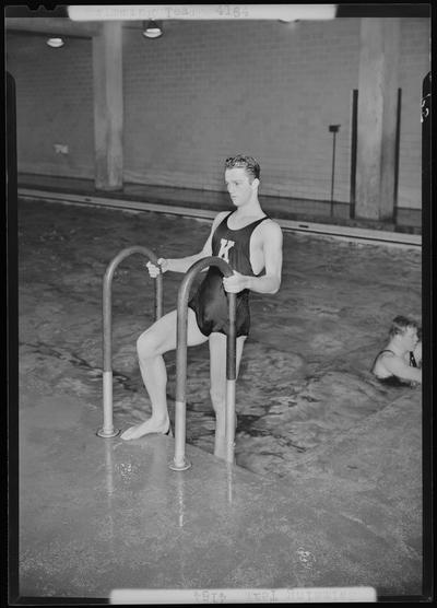 Swimming Team; (1939 Kentuckian) (University of Kentucky); man using pool ladder to exit pool