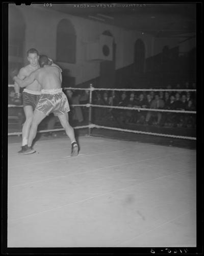 Boxing; (1939 Kentuckian) (University of Kentucky); boxing match in progress, fighters throwing punches