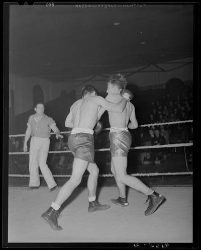 Boxing; (1939 Kentuckian) (University of Kentucky); boxing match, fighters throwing punches