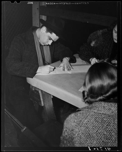 Registration Line; (1939 Kentuckian) (University of Kentucky); people filling out forms