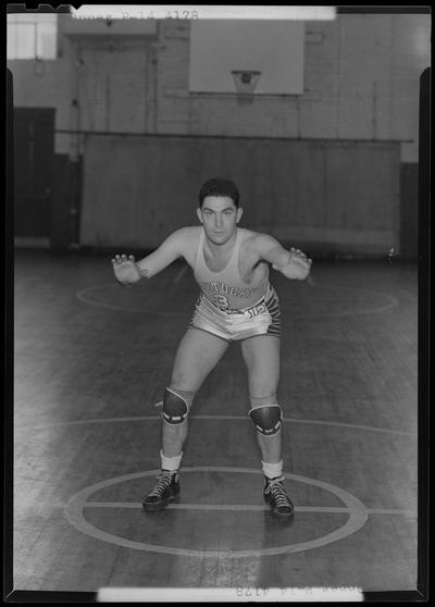 University of Kentucky varsity basketball team; individual team member on basketball court, number 3 (no. 3), Opper poised in the guard position