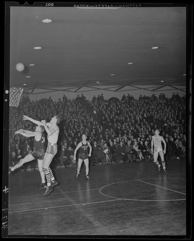 Basketball; Xavier verses Kentucky game (1939 Kentuckian) (University of Kentucky), players on court