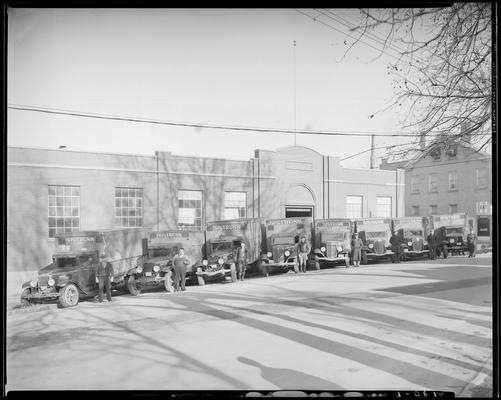 W. T. Sistrunk & Company, 601-603 West High; eight (8) trucks parked in front of company's building, drivers standing besides trucks