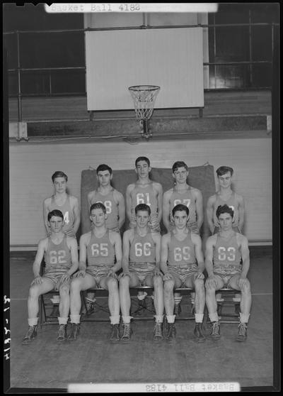 Versailles High School; Basketball team, team group portrait on the basketball court inside the gymnasium