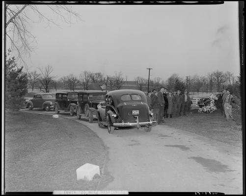 Roxie Highland; horse burial, Spindletop Farm, men standing next to grave, cars parked along the driveway