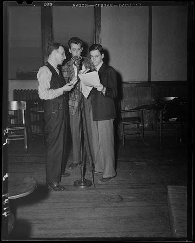 Miscellaneous (1939 Kentuckian) (University of Kentucky); three (3) men standing next to a microphone