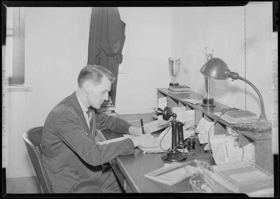 L.T. Inglehart (1939 Kentuckian) (University of Kentucky); man sitting at a desk writing