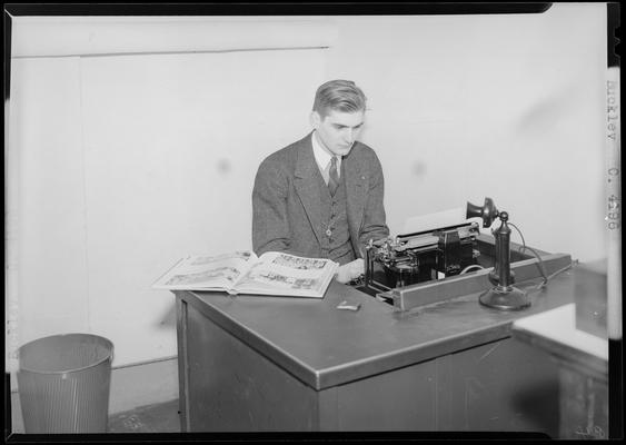 Buckley (1939 Kentuckian) (University of Kentucky); man sitting at a desk typing