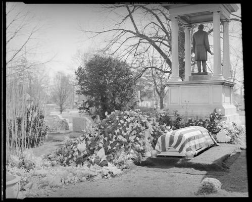 Mrs. Roger Williams; grave; casket on grave site, American flag draped over casket