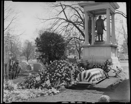 Mrs. Roger Williams; grave; casket on grave site, American flag draped over casket