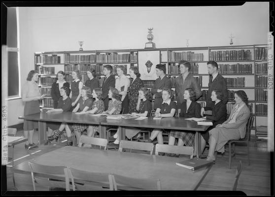 Versailles High School, Beta Club; members sitting around a table in the library