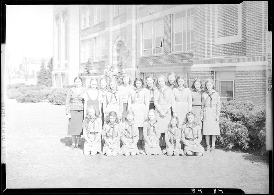 Versailles High School, Girl Scouts; members posing for group portrait on the lawn next to the High School building