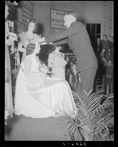 Bryan Station School; Queen & Attendants, Crowning of Queen, man placing crown on Queen's head