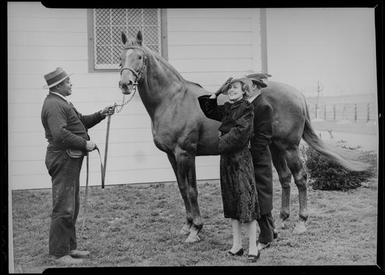 Will Harbut with Man O' War (Horse); Faraway Farm; unidentified people (possibly Jeanette McDonald) standing next to horse; photos ordered by Mr. Wilder and charged to the Lexington Board of Commerce