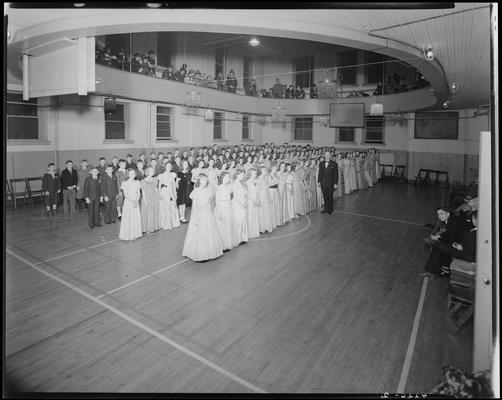 Margorie Hall; dance; girls and boys lined up on the dance floor (basketball court in the gymnasium)