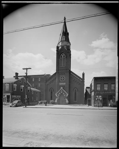 Main Street Baptist Church, 582 West Main; exterior, front view; man standing in front of church; Glass Stores, 568 West Main; Colonial Cafe, 576 West Main