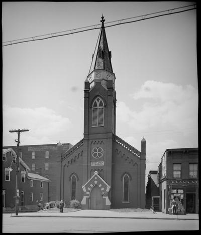 Main Street Baptist Church, 582 West Main; exterior, front view; man standing in front of church; Glass Stores, 568 West Main; Colonial Cafe, 576 West Main