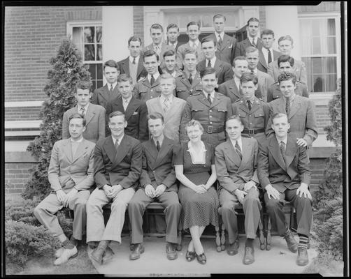 Delta Tau Delta; group portrait on the steps of unidentified building