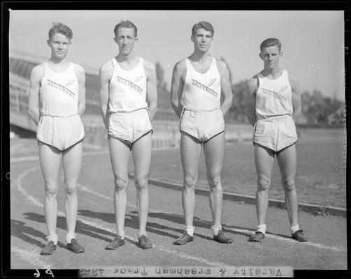 University of Kentucky Varsity and Freshman track team, (1940 Kentuckian) (University of Kentucky); group portrait, four members standing on track