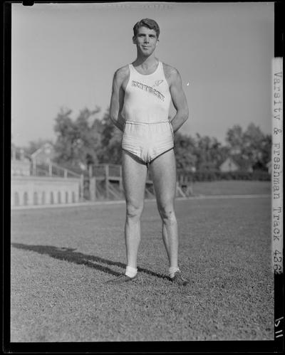 University of Kentucky Varsity and Freshman track team, (1940 Kentuckian) (University of Kentucky); individual member (Captain Jim Doyle) standing on the field