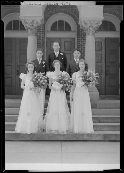 Ashland Avenue Temple; group portrait on steps to temple, three women in formal dress (attire) holding bouquets, three men standing behind the women