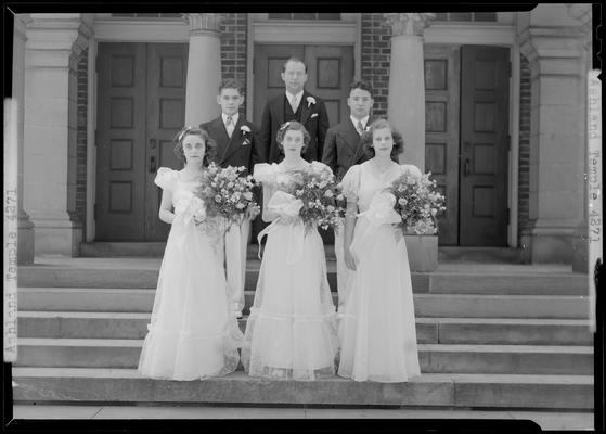 Ashland Avenue Temple; group portrait on steps to temple, three women in formal dress holding bouquets, three men standing behind the women