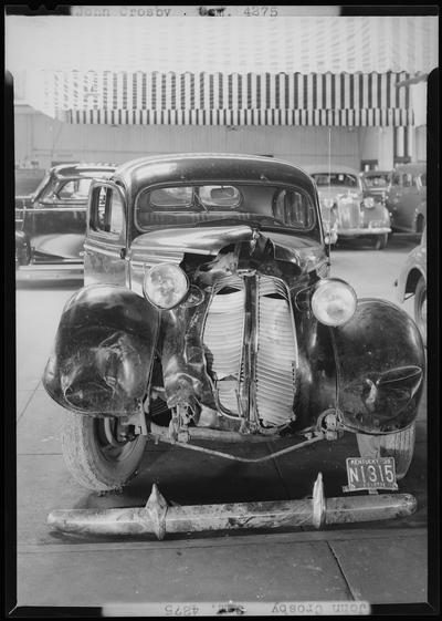 John Crosby; two wrecked cars, Bentley & Baker; damaged (wrecked) car parked in lot, damaged front end; 1939 Kentucky (KY) license plate Fayette N1315