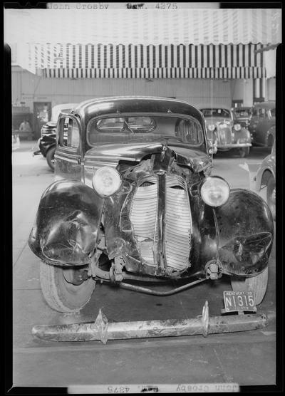 John Crosby; two wrecked cars, Bentley & Baker; damaged (wrecked) car parked in lot, damaged front end; 1939 Kentucky (KY) license plate Fayette N1315