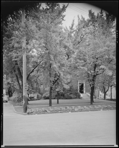Mr. Colhert; home of Virginia S. Parker, exterior view of house, landscape and stone wall from across the street