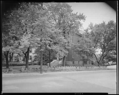 Mr. Colhert; home of Virginia S. Parker, exterior view of house, landscape and stone wall from across the street