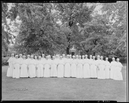 St. Joseph's Hospital, 544 West Second (2nd) Street; group portrait, large group of sisters (nuns) standing outside on the grass (lawn)